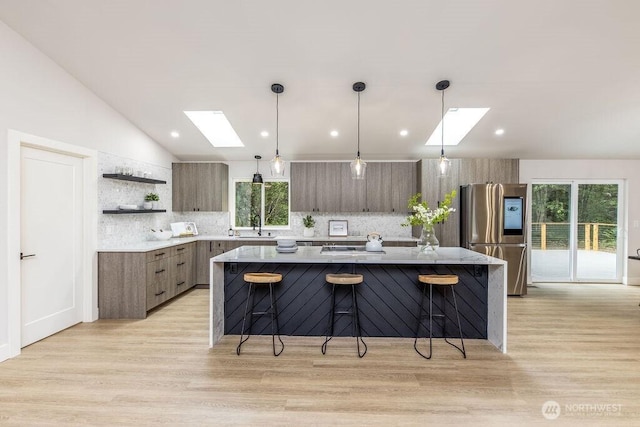 27716 114th Ave E, Graham, WA 98338 - kitchen featuring tasteful backsplash, stainless steel refrigerator with ice dispenser, modern cabinets, and open shelves
