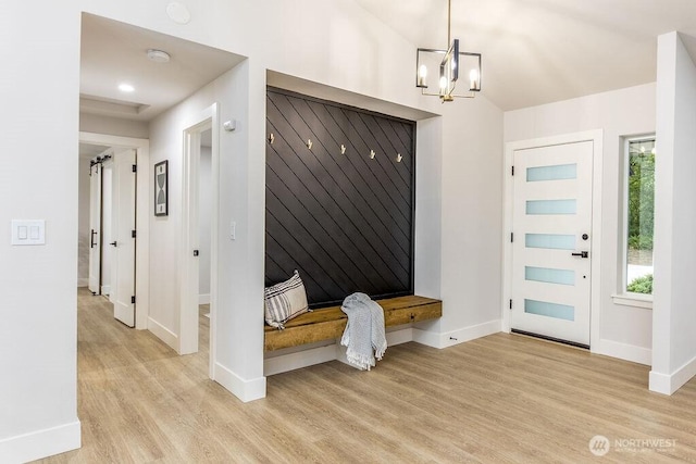 27716 114th Ave E, Graham, WA 98338 - mudroom with baseboards, light wood-type flooring, and an inviting chandelier