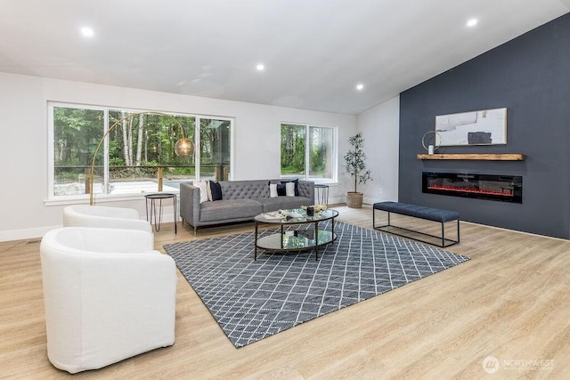 27716 114th Ave E, Graham, WA 98338 - living area featuring lofted ceiling, wood finished floors, and recessed lighting