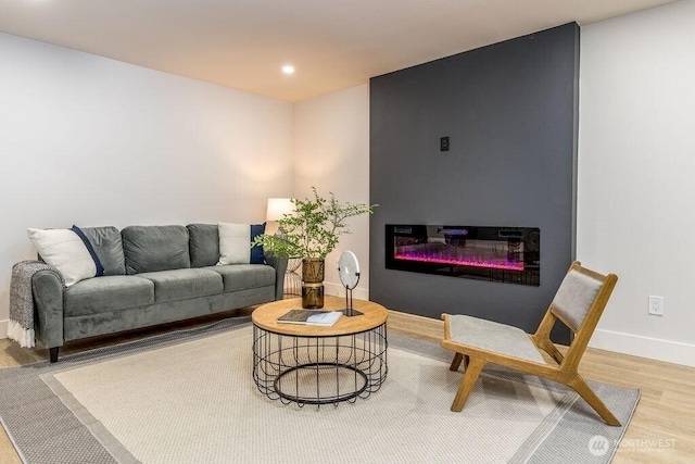 27716 114th Ave E, Graham, WA 98338 - living area featuring recessed lighting, baseboards, wood finished floors, and a glass covered fireplace