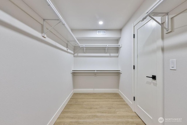 27716 114th Ave E, Graham, WA 98338 - spacious closet featuring wood finished floors and visible vents