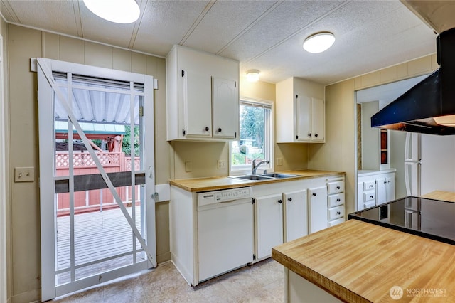 kitchen featuring exhaust hood, a sink, white cabinets, wood counters, and white appliances
