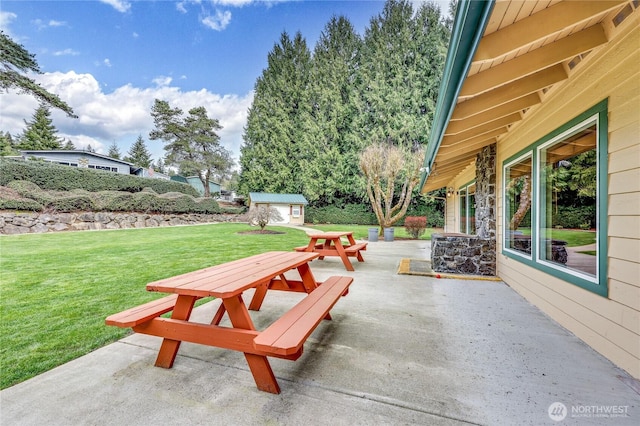 view of patio / terrace with an outbuilding