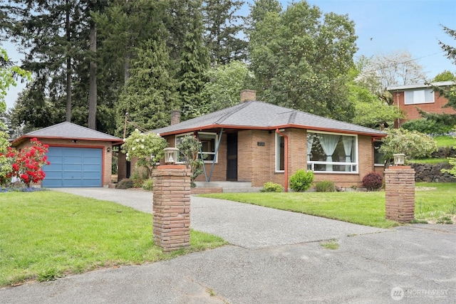 view of front facade featuring brick siding, a garage, a front yard, a chimney, and driveway