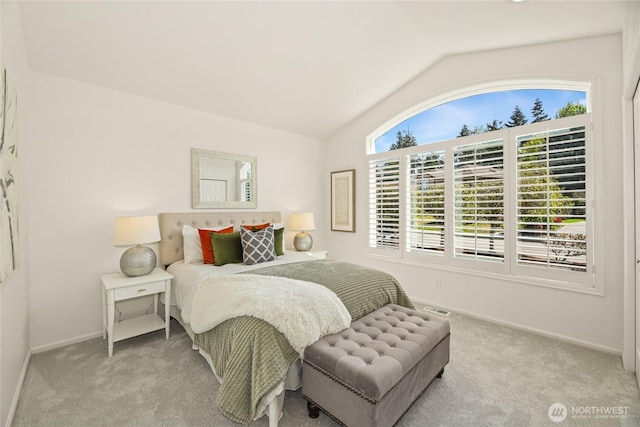 bedroom featuring carpet floors, baseboards, visible vents, and lofted ceiling