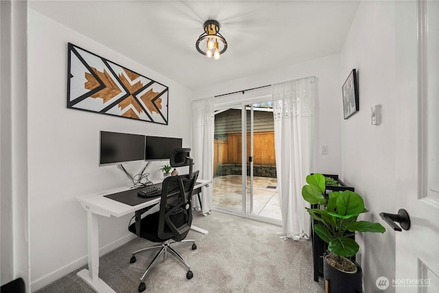 carpeted office with baseboards