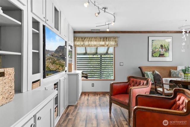 interior space with baseboards and hardwood / wood-style floors
