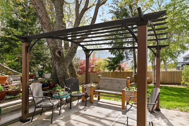 view of patio featuring a pergola and a fenced backyard