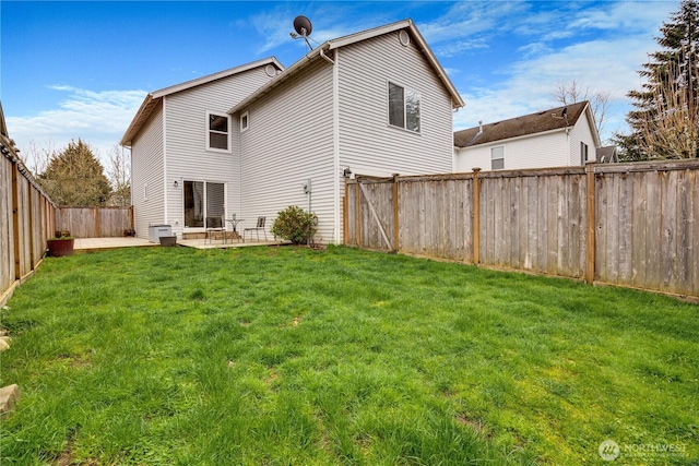 back of property featuring a patio, a fenced backyard, and a lawn