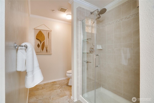 bathroom featuring a shower stall, visible vents, baseboards, toilet, and ornamental molding