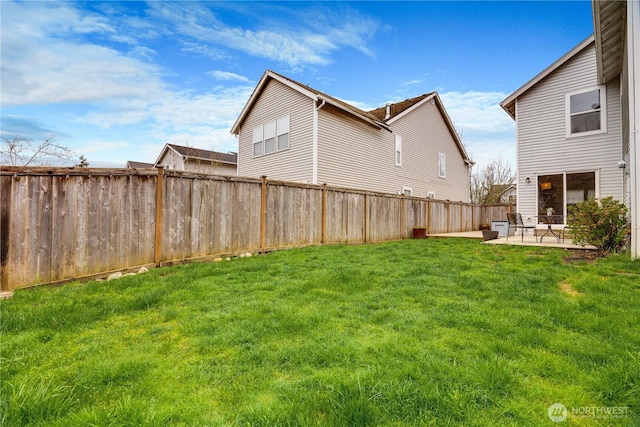 view of yard with a fenced backyard and a patio area