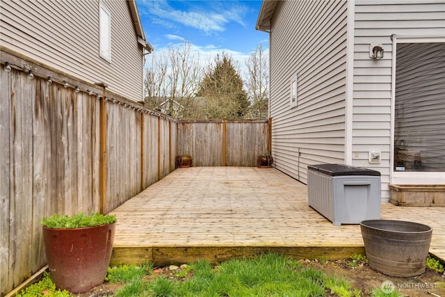 exterior space featuring a deck and a fenced backyard