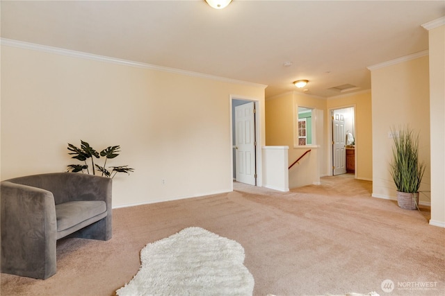 sitting room with an upstairs landing, baseboards, ornamental molding, and carpet floors