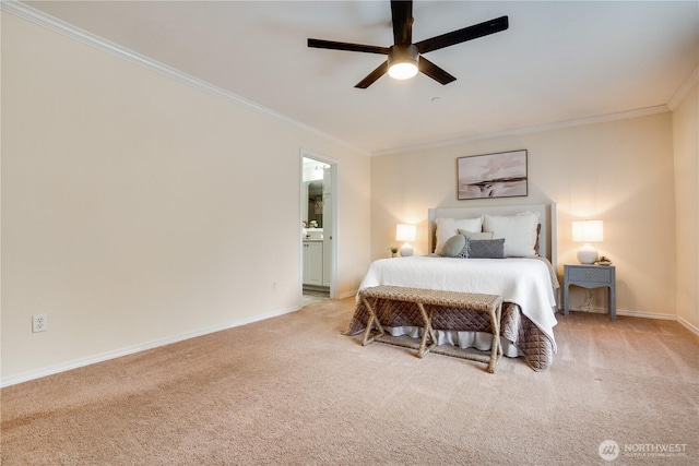 bedroom featuring baseboards, ornamental molding, ensuite bath, and carpet