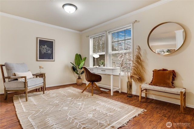 living area with wood finished floors, crown molding, and baseboards