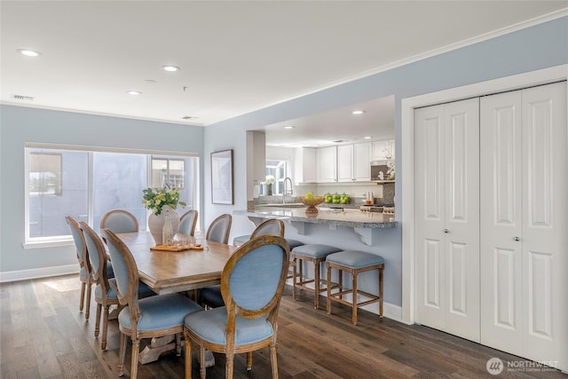 dining room featuring dark wood-style flooring, visible vents, and recessed lighting