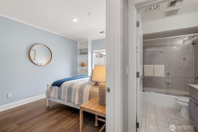 bedroom with crown molding, baseboards, recessed lighting, and visible vents