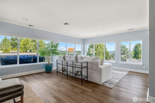 sunroom / solarium with visible vents and plenty of natural light