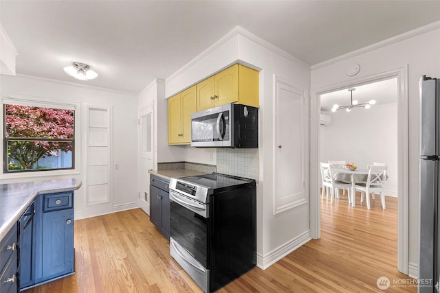 kitchen with an inviting chandelier, light wood-style flooring, stainless steel appliances, tasteful backsplash, and ornamental molding
