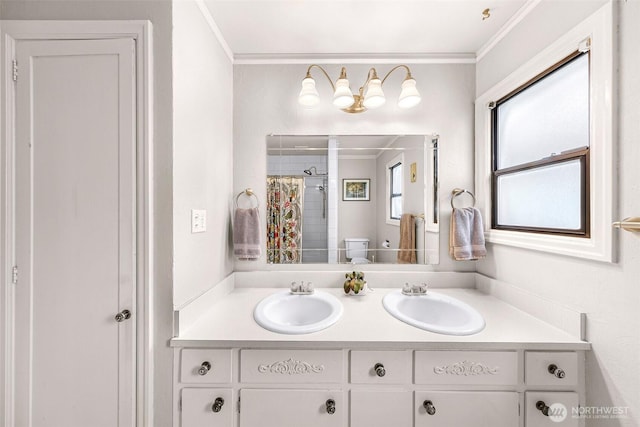 full bathroom with a sink, curtained shower, toilet, and ornamental molding