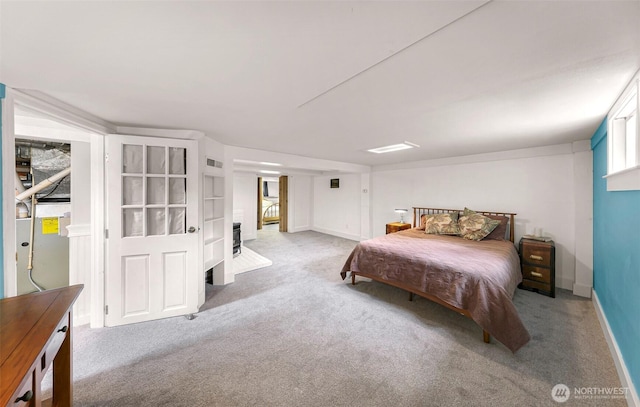 bedroom featuring baseboards, visible vents, and carpet
