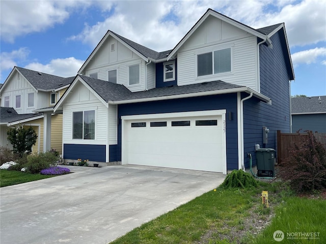 view of front of home with an attached garage, board and batten siding, fence, and concrete driveway