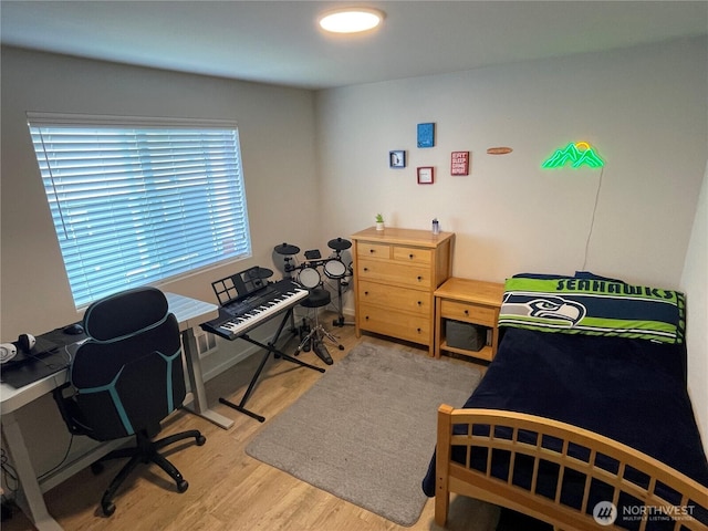bedroom featuring light wood finished floors