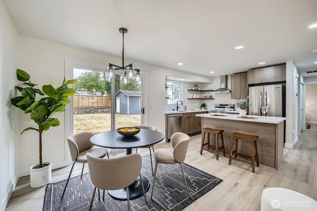 2613 Pike St SE, Auburn, WA 98002 - dining area featuring light wood-style floors, baseboards, and recessed lighting