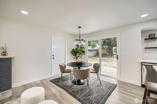 2613 Pike St SE, Auburn, WA 98002 - dining area featuring light wood-style flooring, baseboards, a chandelier, and recessed lighting