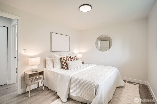 2613 Pike St SE, Auburn, WA 98002 - bedroom with baseboards and light wood-style flooring