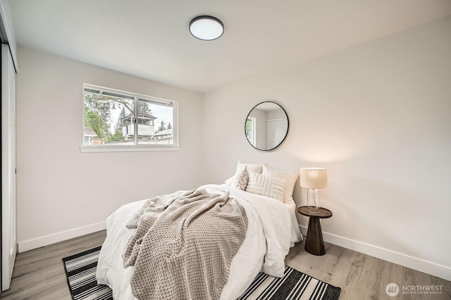 2613 Pike St SE, Auburn, WA 98002 - bedroom with baseboards and wood finished floors