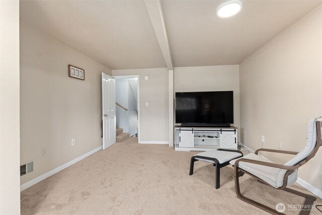sitting room featuring carpet floors and baseboards
