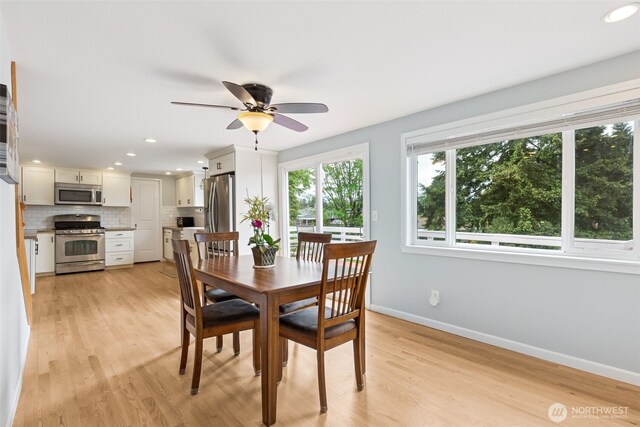 dining space featuring baseboards, ceiling fan, light wood finished floors, and recessed lighting