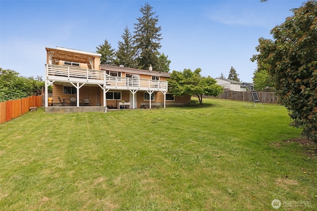 back of house featuring a deck
