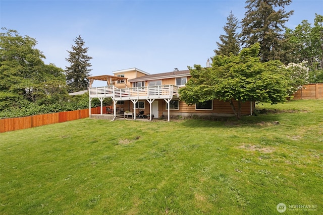 rear view of property featuring a deck