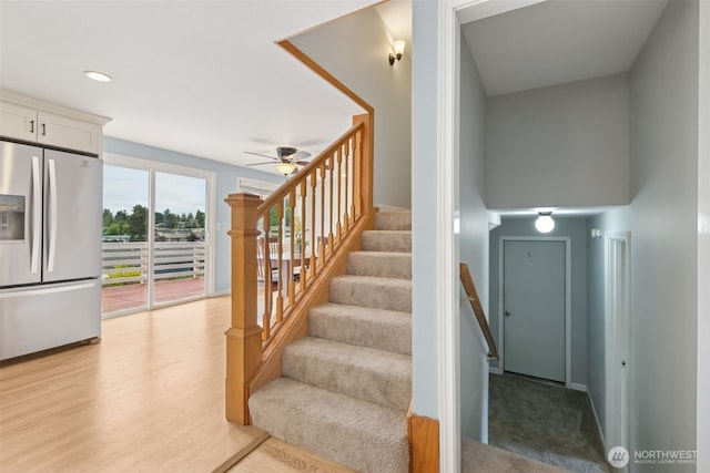 stairway featuring a ceiling fan, recessed lighting, and wood finished floors