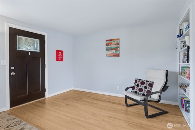entryway featuring light wood-style flooring and baseboards