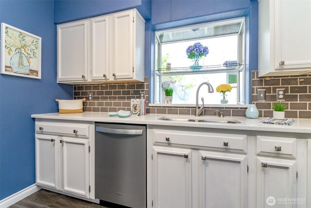 kitchen featuring a sink, light countertops, white cabinetry, and dishwasher