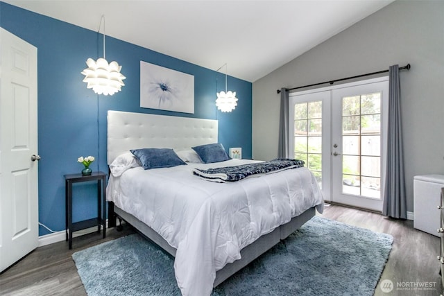 bedroom featuring french doors, access to exterior, wood finished floors, baseboards, and lofted ceiling