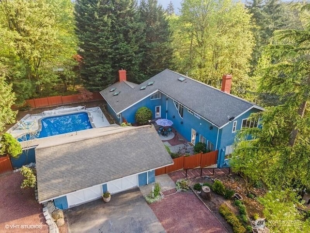 aerial view featuring a wooded view
