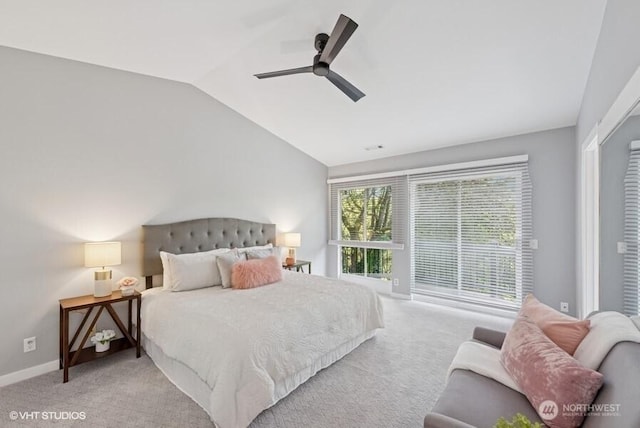 bedroom featuring baseboards, access to outside, light colored carpet, and lofted ceiling