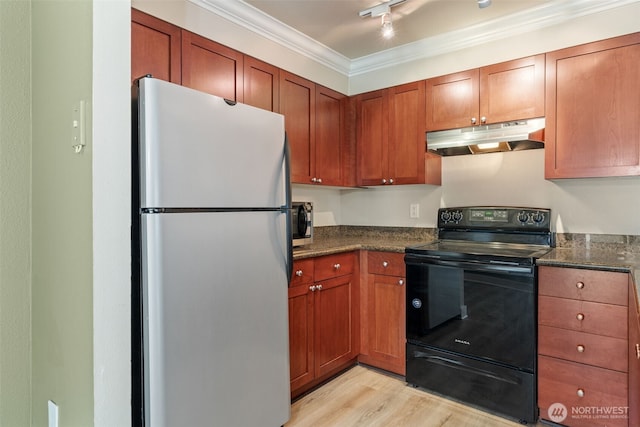 kitchen featuring brown cabinets, light wood finished floors, stainless steel appliances, under cabinet range hood, and ornamental molding
