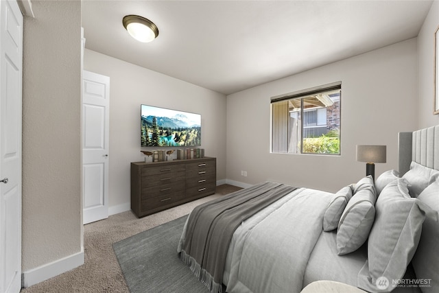 bedroom featuring carpet floors and baseboards