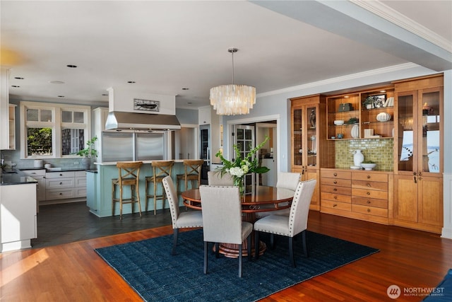 9325 Fauntleroy Way SW, Seattle, WA 98136 - dining space featuring a chandelier, ornamental molding, and dark wood-type flooring