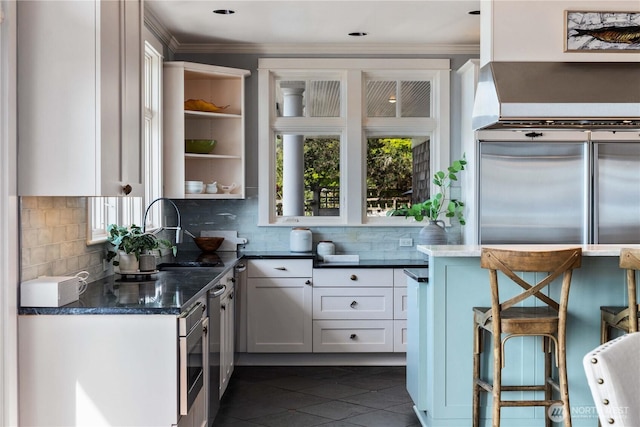 9325 Fauntleroy Way SW, Seattle, WA 98136 - kitchen with plenty of natural light, open shelves, backsplash, and ornamental molding