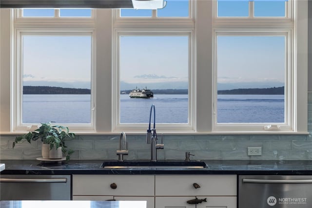 9325 Fauntleroy Way SW, Seattle, WA 98136 - kitchen featuring white cabinetry, dark countertops, a sink, and dishwasher