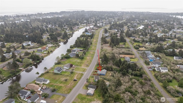 bird's eye view with a water view and a residential view