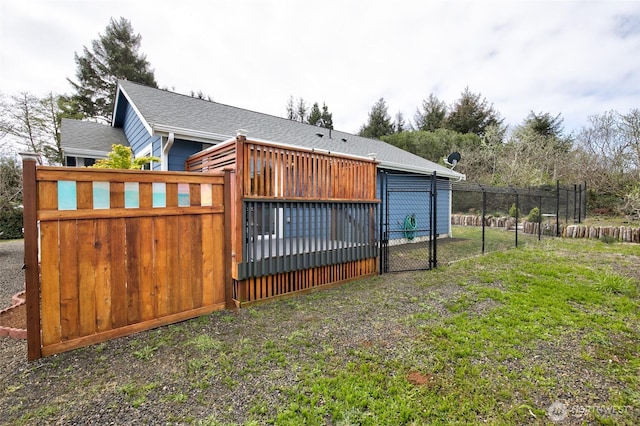 view of gate featuring fence