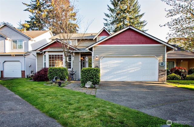 view of front of home with driveway, a front yard, and a garage