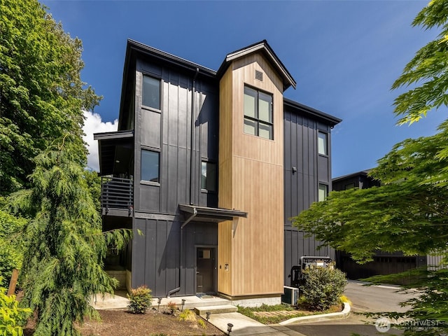 rear view of house with board and batten siding